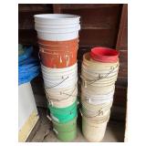 Stack of Assorted Plastic Buckets