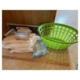 Pile of Fabric and Laundry Basket