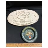 This is a decorative wall plaque featuring