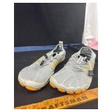 Gray Athletic Shoes with Orange Accents