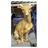 This vintage greyhound figurine, likely made of