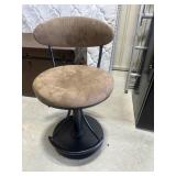 Brown upholstered swivel accent chair with black