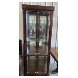 Corner display cabinet with lights. There is one