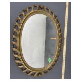 Plastic framed oval hanging mirror