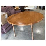 Round wood drop leaf table with extra leaf