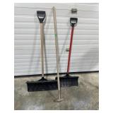 Garden hose and two snow shovels