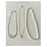 Three necklaces, 2 are 20ï¿½ and one is 18ï¿½.
