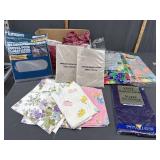 Miscellaneous box lot-assorted tablecloths/ baby