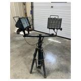 portable twin-head halogen work light mounted on
