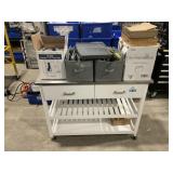 White Cabinet, With Blue Tapes, and Toilet Seatcov