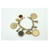 14K CHARM BRACELET WITH (9) 14K CHARMS