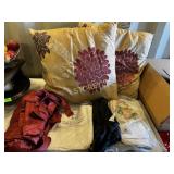 2 LG Throw Pillows, Red Curtains, Table 2 LG Throw Pillows, Red Curtains, Table