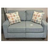 Blue couch with decorative pillows