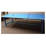 Large blue work table with plug-in outlets