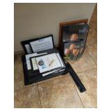 Assortment of picture frames and easel