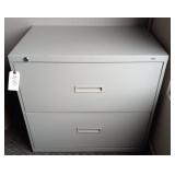 Beige two drawer metal filing cabinet with