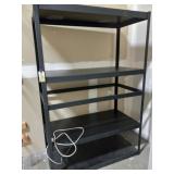 Black metal shelves with surge protector