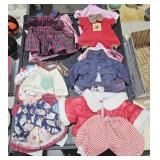Box of doll clothing