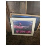 - n two vintage framed car posters