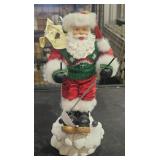 Vintage Santa figurine on skis