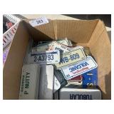 Box of mini collectible license plate decor