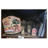 Glass head book ends, and other trinkets all on th