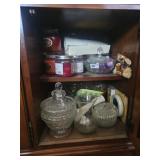 Shelf of candles and candy dishes