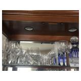 Whole shelf of glass serving drinking items