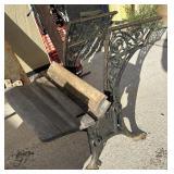 Vintage cast iron school desk was used as yard art