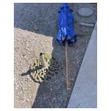 Large blue fabric umbrella with stand
