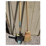 Two brooms and a shovel