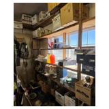 Shelves with miscellaneous items, bolts, hose,