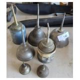 Assortment of oil cans