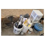 Assortment of paint, cans, and fan