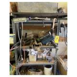 Metal shelf with contents chains and bungees