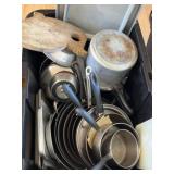 Tote of pots and pans and whale cutting board
