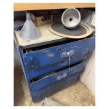 Blue metal drawers with contents