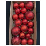 Several Matte and Glittery Red Ornaments As