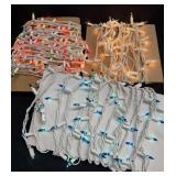 3 Strands Of Christmas Lights On White Wire As