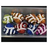 Several Glitter Fish Christmas Ornaments In A