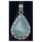 Native American turquoise pendant with roped