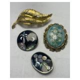 4 Brooches all of which are signed