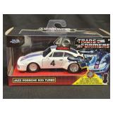 (D) Jada Toys Transformers G1 Jazz 1976 Porsche