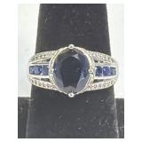 (SC) Large Oval-Cut Blue Sapphire With Smaller