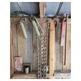 Contents of Wall- Greese Guns, Tire Chains & more