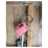 Contents of Wall- Cable, Gas Can & Hanger