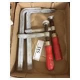 Box containing large clamps