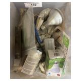 Large plastic container containing lightbulbs,