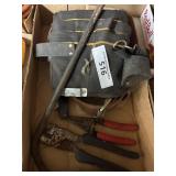 Box lock containing tool, apron, cable cutters,