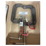 Box containing two large clamps and more